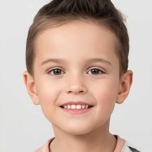 Joyful white child male with short  brown hair and brown eyes