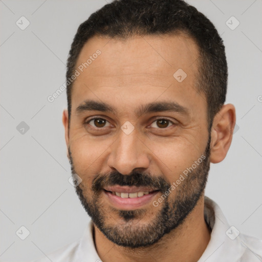 Joyful latino young-adult male with short  black hair and brown eyes