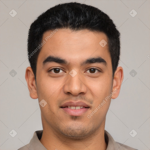 Joyful latino young-adult male with short  black hair and brown eyes