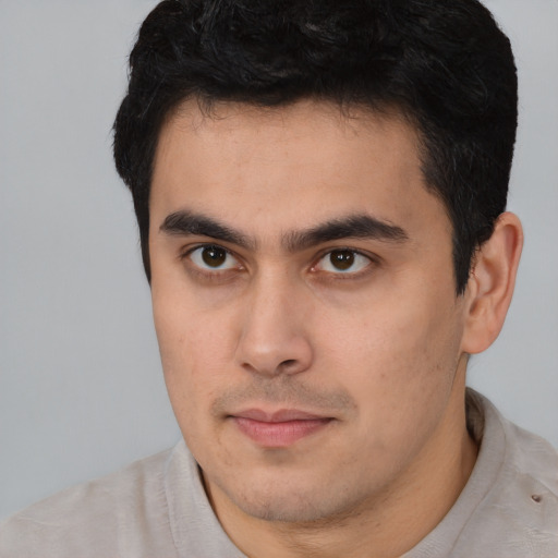 Neutral latino young-adult male with short  brown hair and brown eyes
