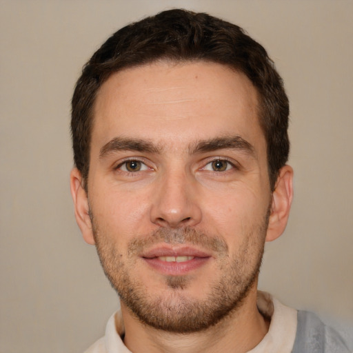 Joyful white young-adult male with short  brown hair and brown eyes