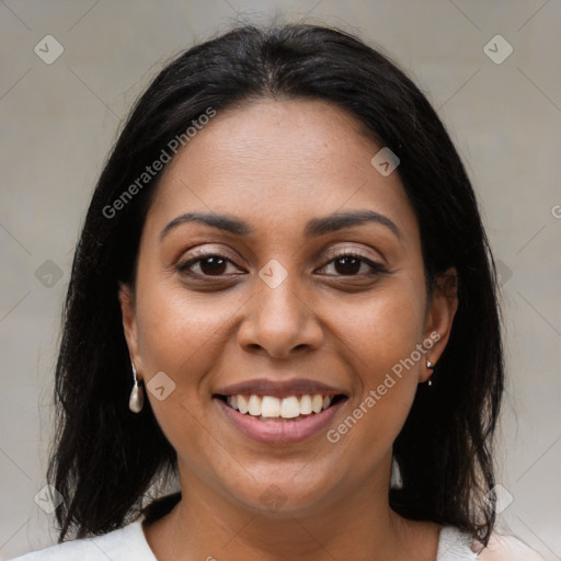 Joyful latino young-adult female with medium  brown hair and brown eyes