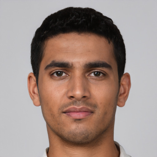 Neutral latino young-adult male with short  black hair and brown eyes