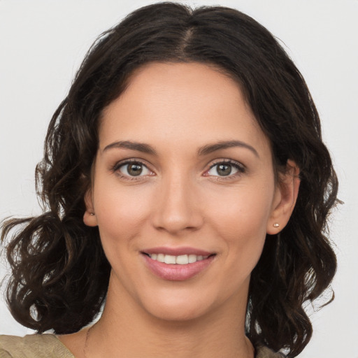 Joyful white young-adult female with medium  brown hair and brown eyes