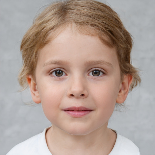 Joyful white child female with short  brown hair and blue eyes