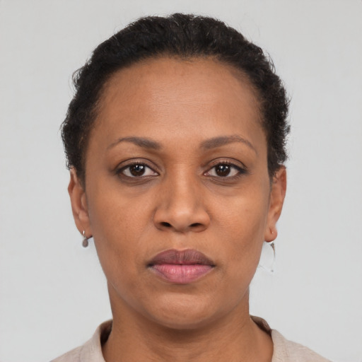 Neutral black adult female with short  brown hair and brown eyes