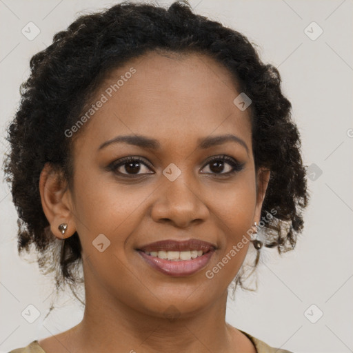 Joyful black young-adult female with medium  brown hair and brown eyes