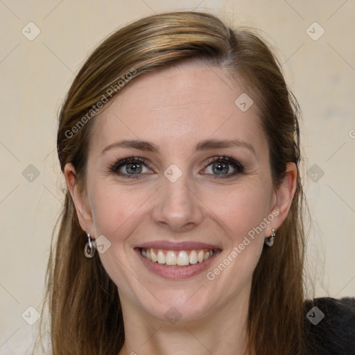 Joyful white young-adult female with long  brown hair and grey eyes