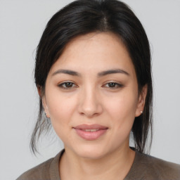 Joyful white young-adult female with medium  brown hair and brown eyes