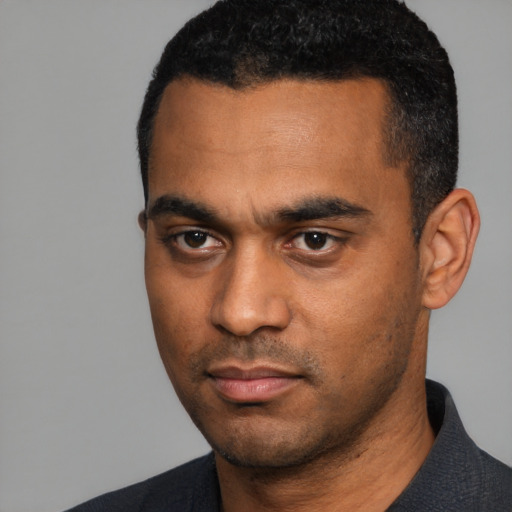 Neutral black young-adult male with short  black hair and brown eyes