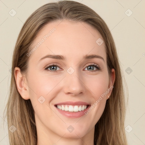 Joyful white young-adult female with long  brown hair and grey eyes