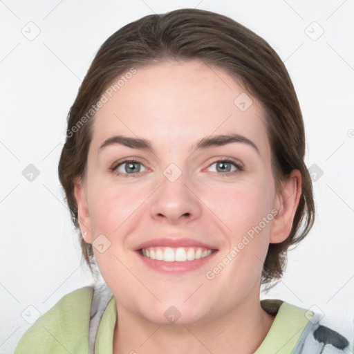 Joyful white young-adult female with medium  brown hair and green eyes