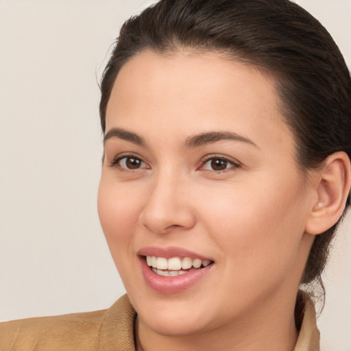 Joyful white young-adult female with medium  brown hair and brown eyes