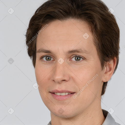 Joyful white adult female with short  brown hair and grey eyes