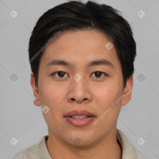 Joyful asian young-adult male with short  brown hair and brown eyes