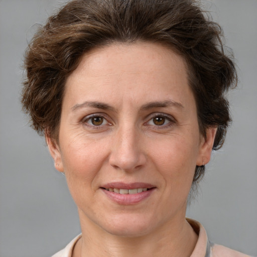 Joyful white adult female with short  brown hair and brown eyes