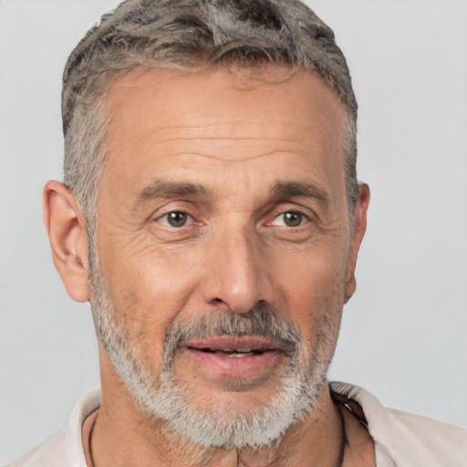 Joyful white middle-aged male with short  gray hair and brown eyes