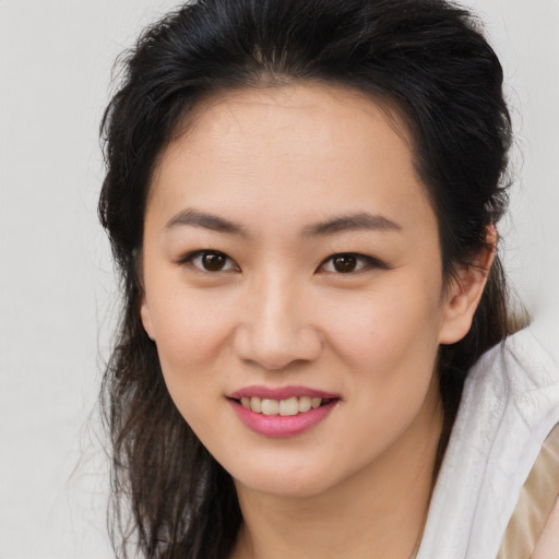 Joyful asian young-adult female with medium  brown hair and brown eyes