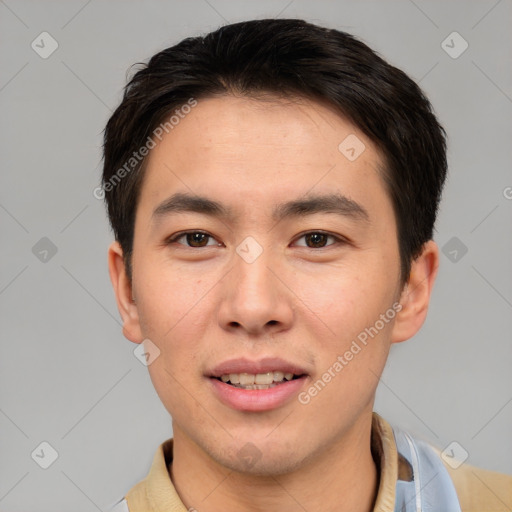 Joyful asian young-adult male with short  brown hair and brown eyes