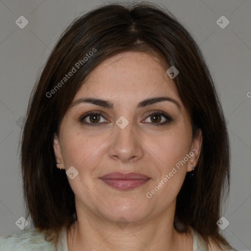 Joyful white adult female with medium  brown hair and brown eyes