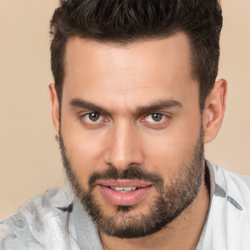 Joyful white young-adult male with short  brown hair and brown eyes