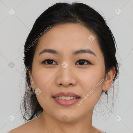 Joyful asian young-adult female with medium  black hair and brown eyes