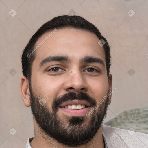 Joyful white young-adult male with short  black hair and brown eyes