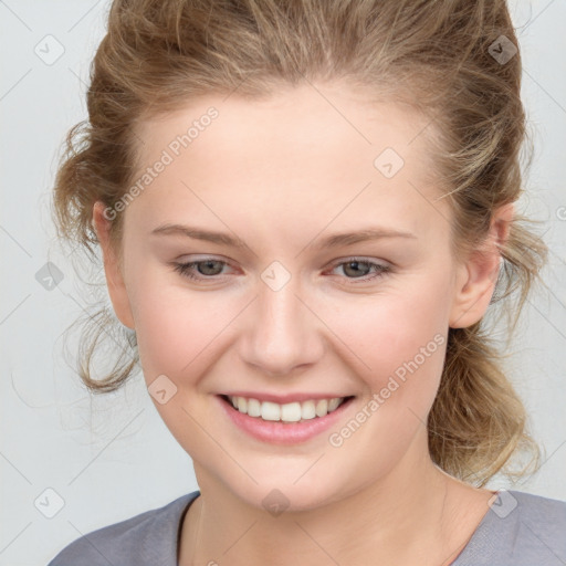 Joyful white child female with medium  brown hair and grey eyes