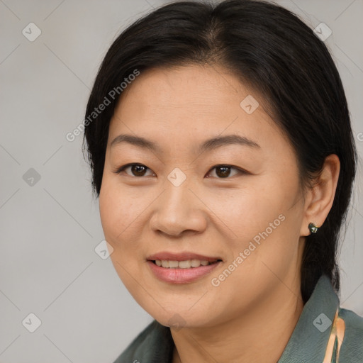 Joyful asian young-adult female with medium  brown hair and brown eyes