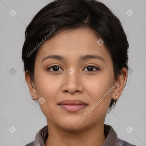 Joyful latino young-adult female with medium  brown hair and brown eyes