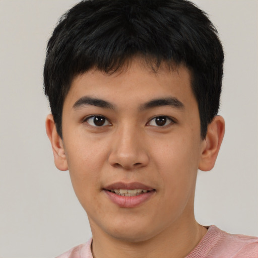 Joyful white young-adult male with short  black hair and brown eyes