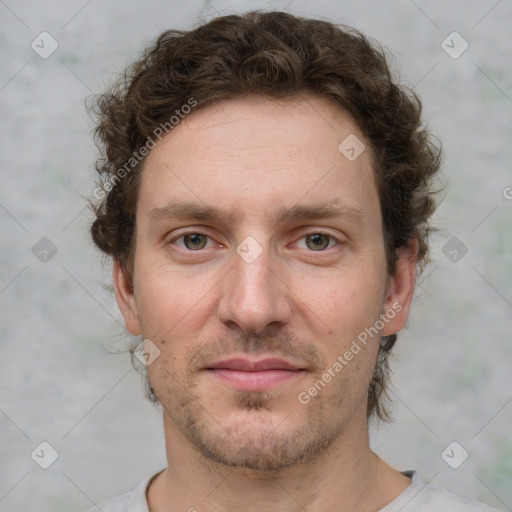 Joyful white adult male with short  brown hair and grey eyes