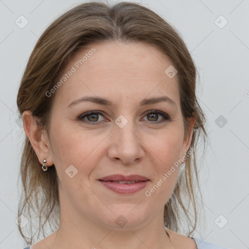 Joyful white adult female with medium  brown hair and grey eyes