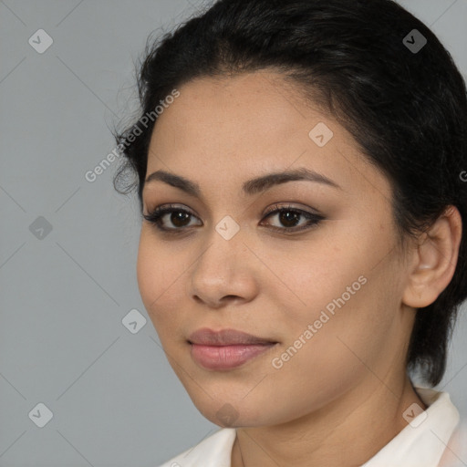 Joyful latino young-adult female with medium  brown hair and brown eyes