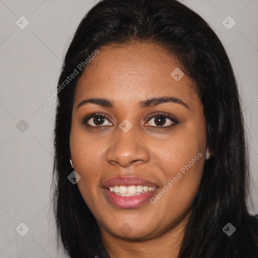 Joyful black young-adult female with long  black hair and brown eyes