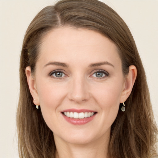 Joyful white young-adult female with long  brown hair and grey eyes