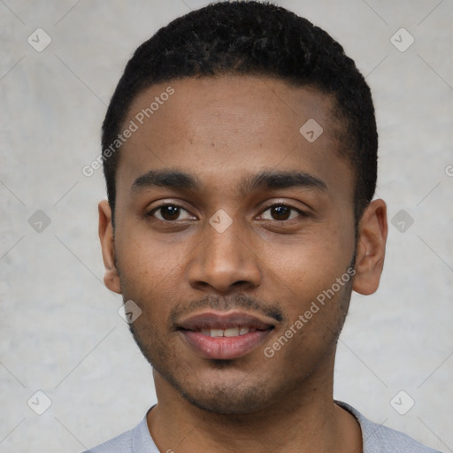 Joyful black young-adult male with short  black hair and brown eyes