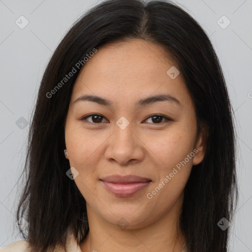 Joyful asian young-adult female with long  brown hair and brown eyes