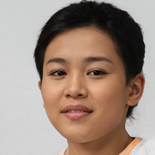Joyful latino young-adult female with short  brown hair and brown eyes