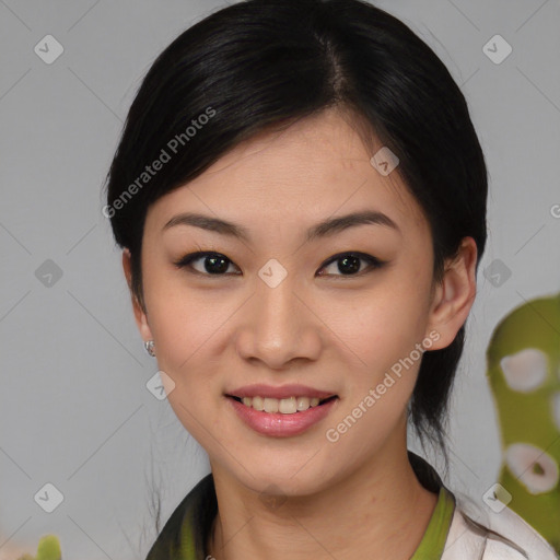 Joyful asian young-adult female with medium  black hair and brown eyes