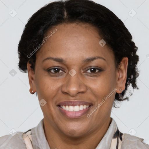 Joyful latino adult female with short  brown hair and brown eyes