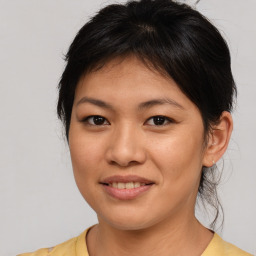 Joyful asian young-adult female with medium  brown hair and brown eyes