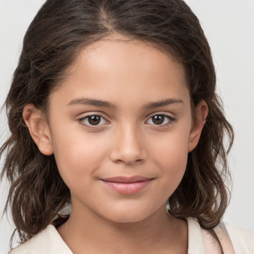 Joyful white child female with medium  brown hair and brown eyes