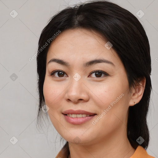 Joyful asian young-adult female with medium  black hair and brown eyes