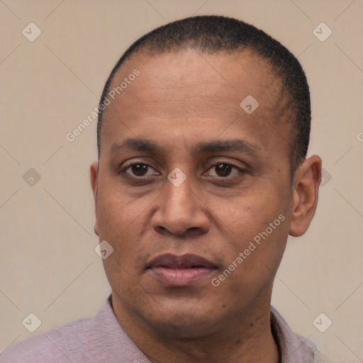 Joyful latino adult male with short  black hair and brown eyes