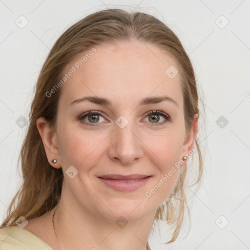 Joyful white young-adult female with medium  brown hair and blue eyes