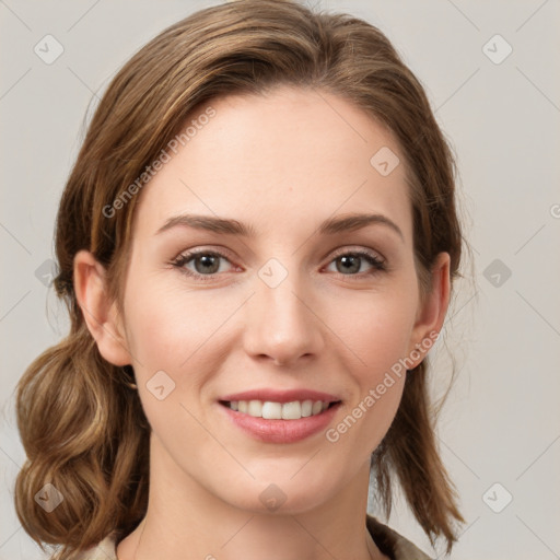 Joyful white young-adult female with medium  brown hair and green eyes