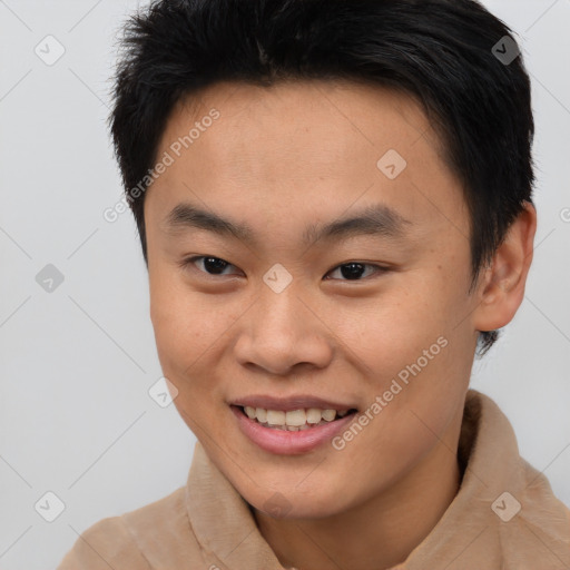 Joyful asian young-adult male with short  brown hair and brown eyes