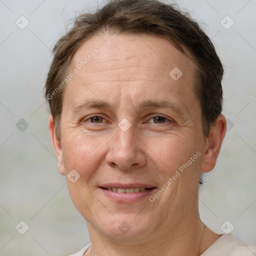 Joyful white adult female with short  brown hair and brown eyes