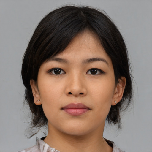 Neutral asian young-adult female with medium  brown hair and brown eyes